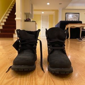 Black Timberlands with velvet details.